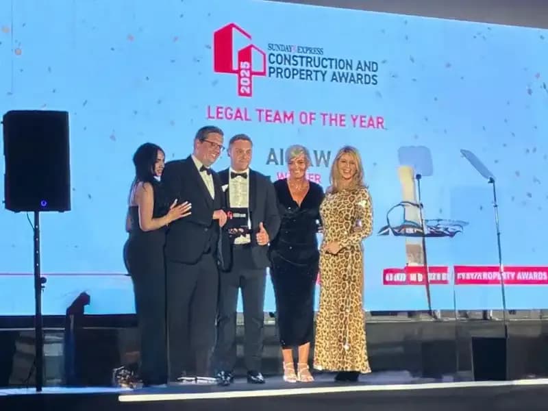 The Ai Law team on stage collecting the Legal Team of the Year award