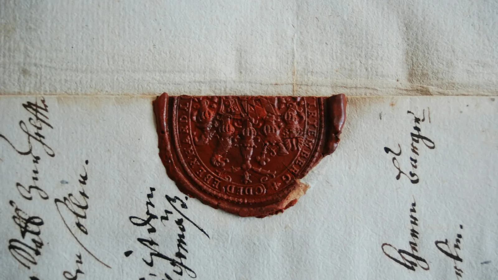 An old handwritten document closed with a red wax seal