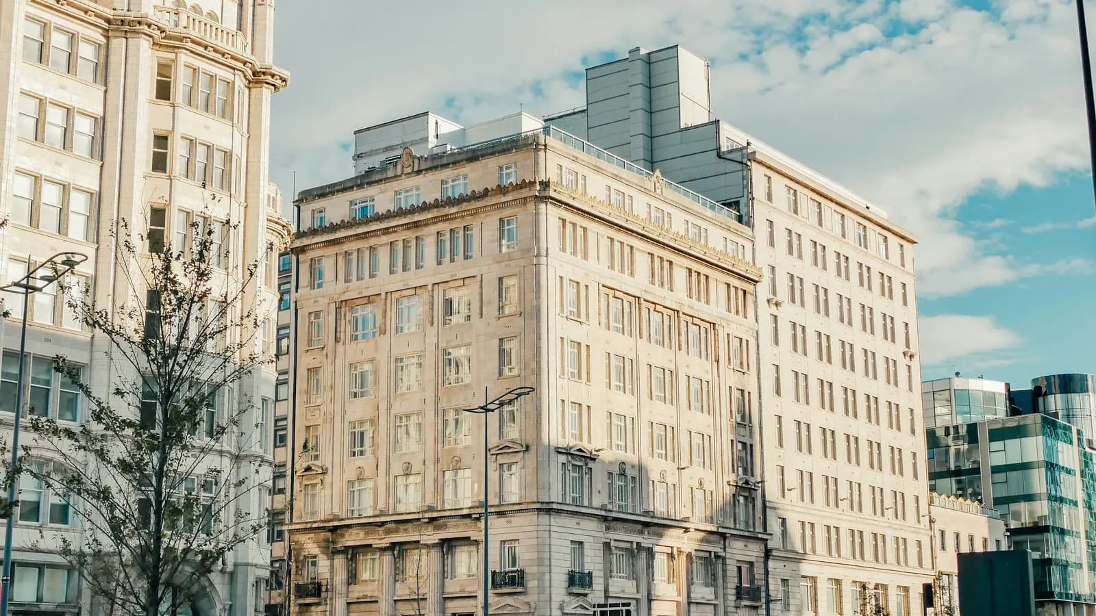 Stone-clad office buildings on a city-centre street in Liverpool